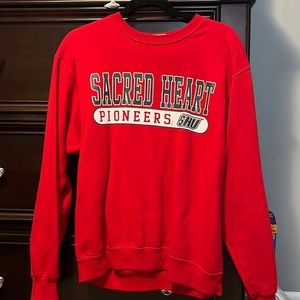 Sacred Heart University Sweatshirt. Brand is MV Sport in a size M